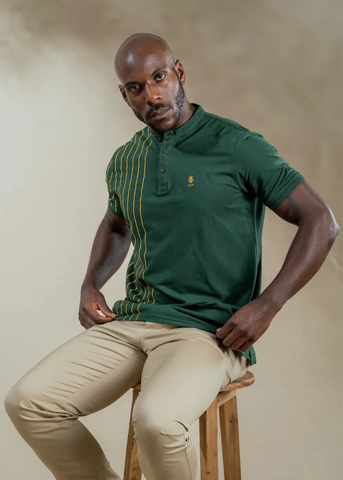Man wearing a Legacy London striped mandarin collar polo shirt