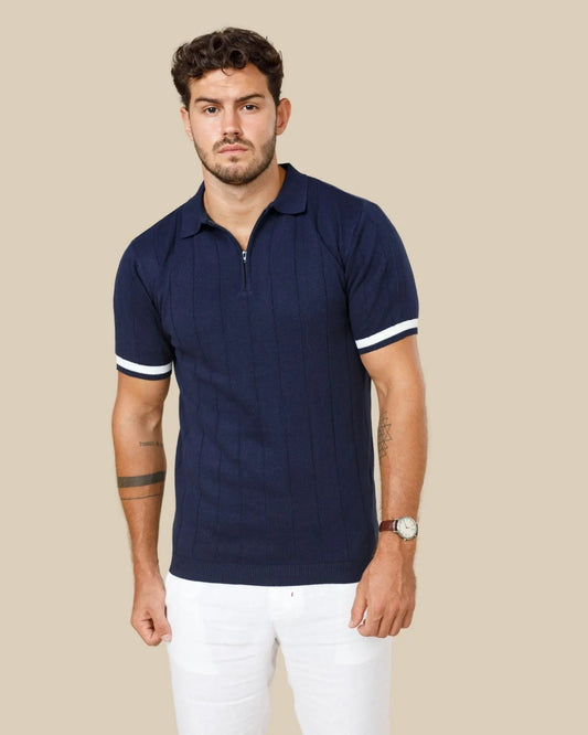 Man wearing a navy ribbed knit polo in fine long-staple cotton, the same principle behind Sea Island cotton