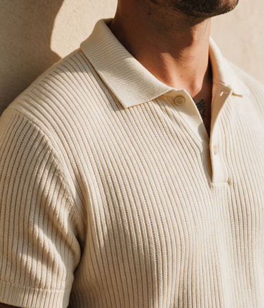 Close-up of a man's cream ribbed knitted polo collar — Legacy London menswear