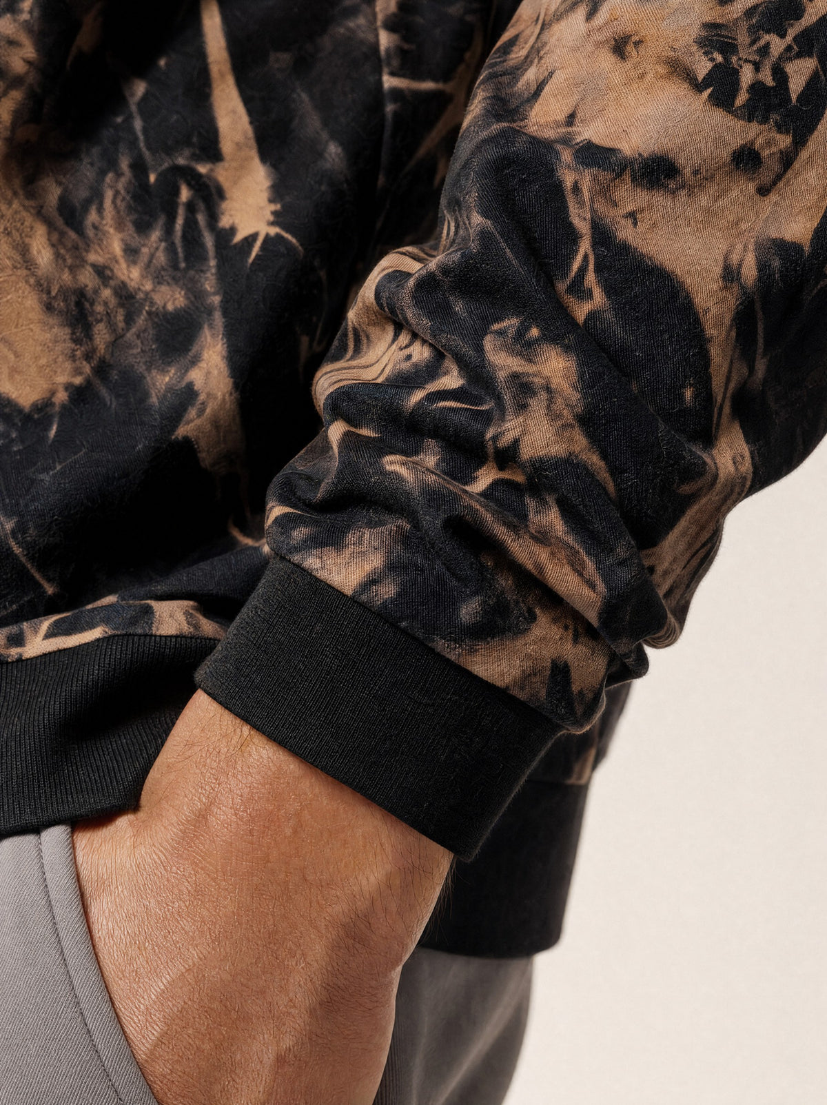 Close-up of the ribbed cuff on the Buff Orange overshirt